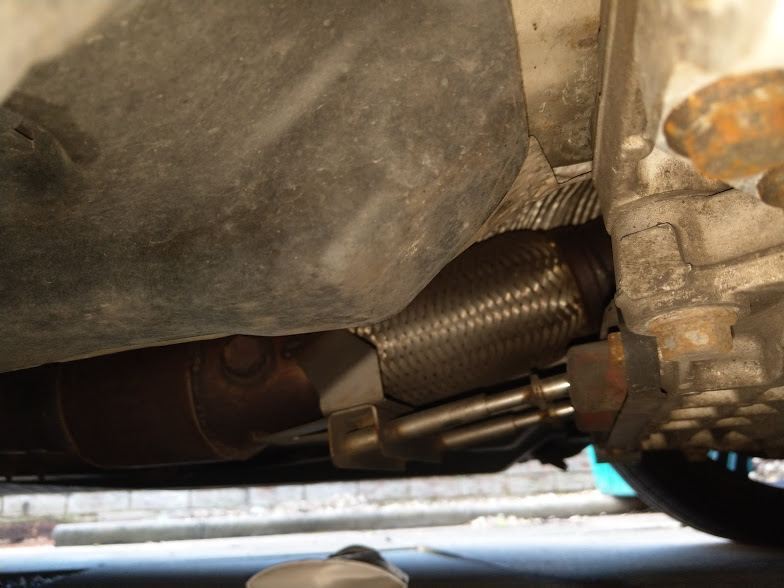 Exhaust knocking handbrake area