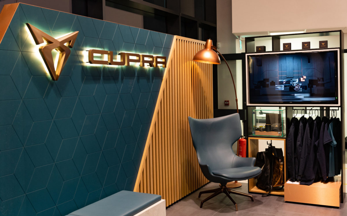 CUPRA seating area with merchandise