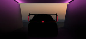 A concept car hidden in the darkness with just some rear lights showing