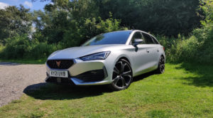 A silver coloured CUPRA Leon estate parked on grass