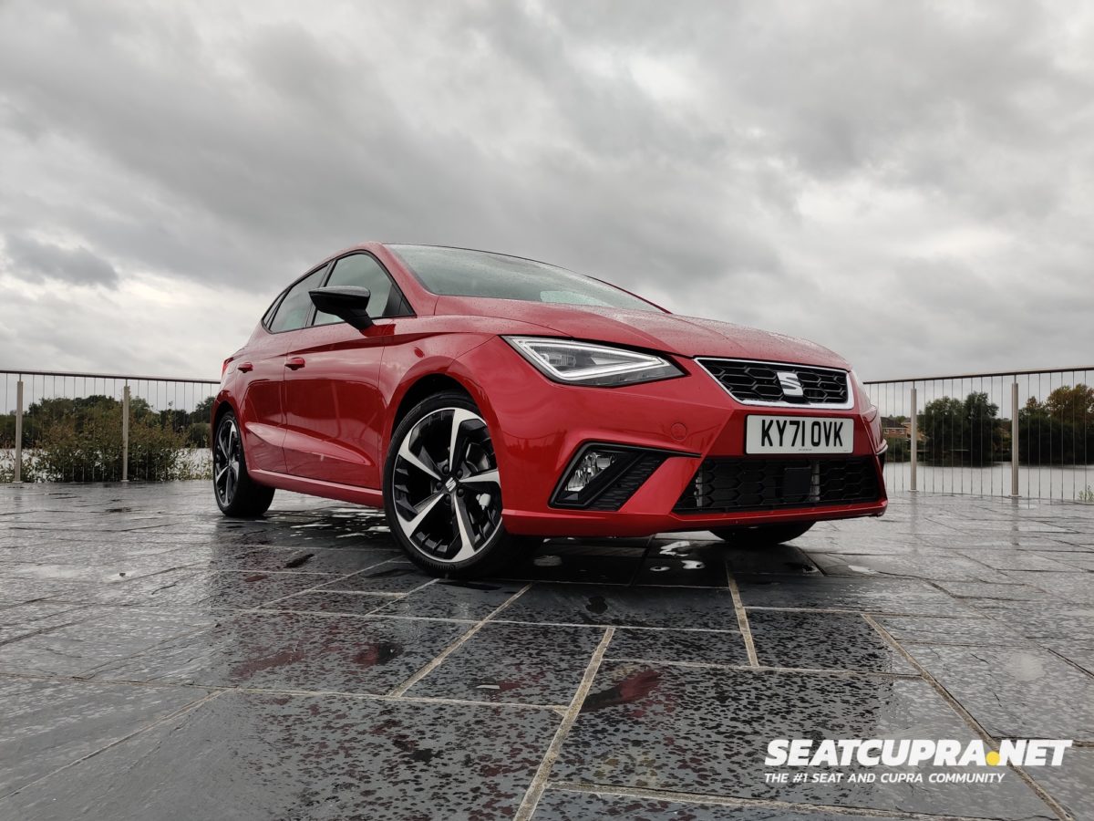 Red SEAT Ibiza FR Sport parked next to a lake