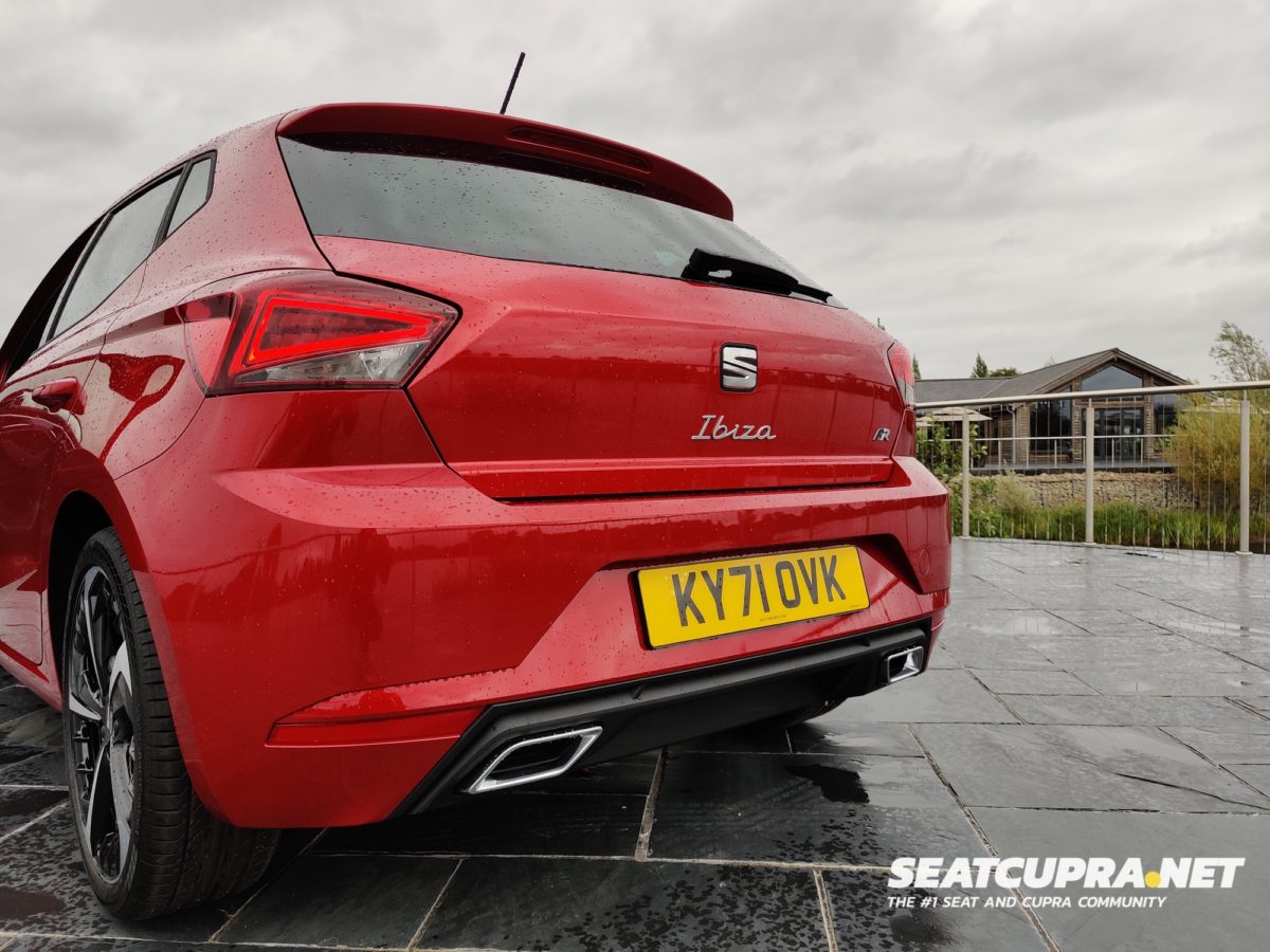 Red SEAT Ibiza FR Sport parked next to a lake - facing the boot