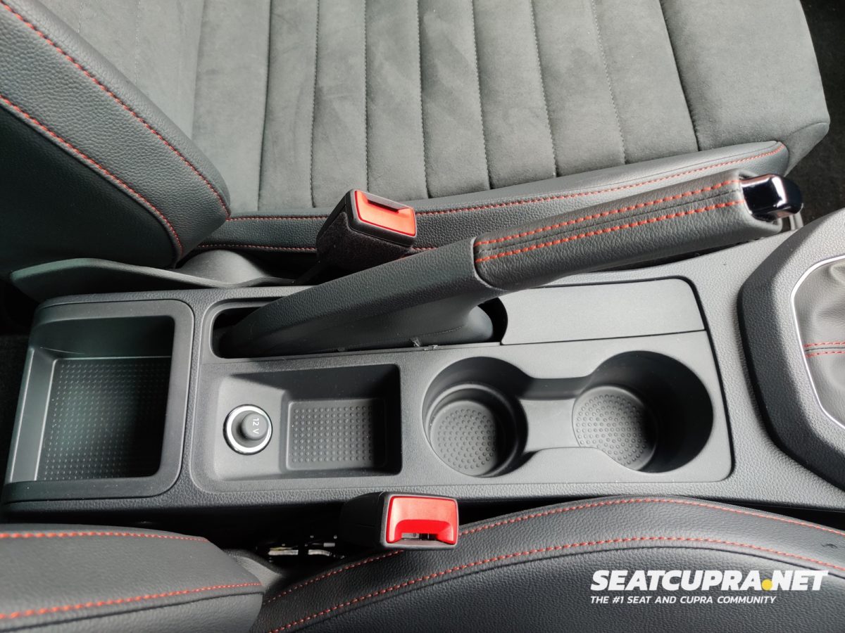 Close up of the hand brake and cup holders