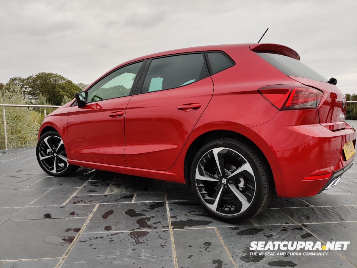 The SEAT Ibiza FR Sport in red parked next to a lake
