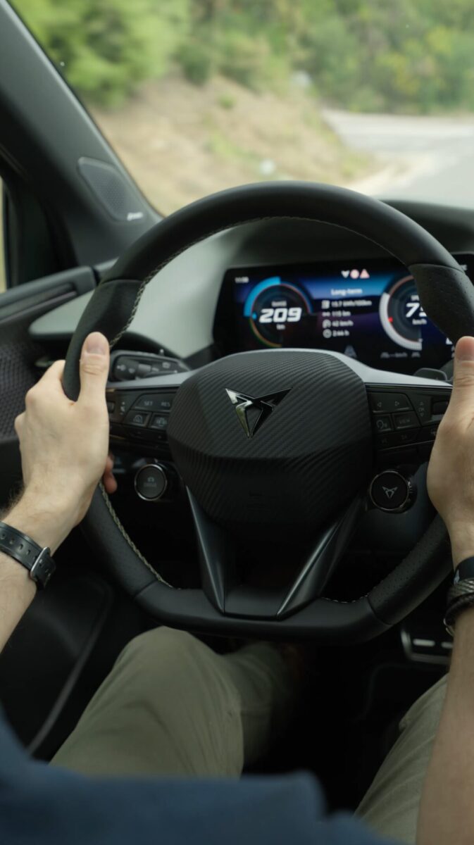 CUPRA Raval VZ Extreme Manganese Matt behind the wheel