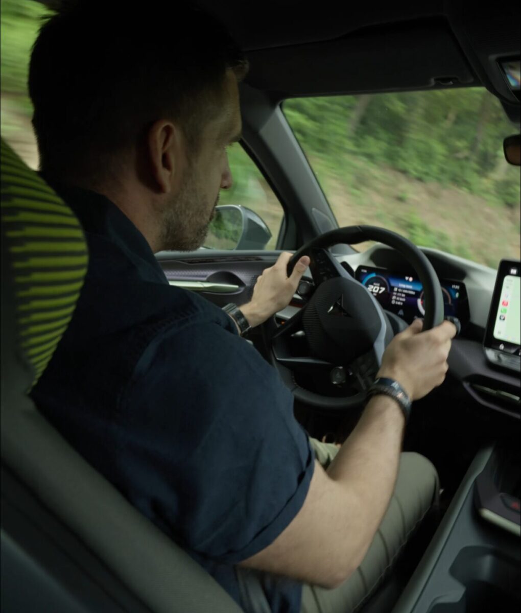 CUPRA Raval VZ Extreme Manganese Matt behind the wheel